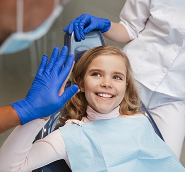 Little girl with dental sealants smiling