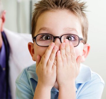 Shocked boy visiting his Nashua emergency pediatric dentist 