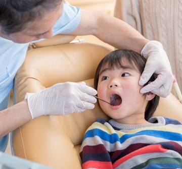 Young child visiting Nashua emergency pediatric dentist for checkup  