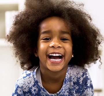 Child with happy, healthy teeth smiling