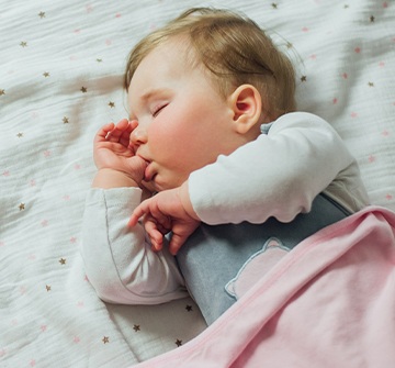 Sleeping baby sucking on thumb before intervention to stop non nutritive habits