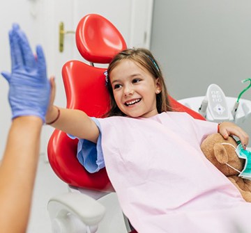 a child visiting her dentist for treatment 