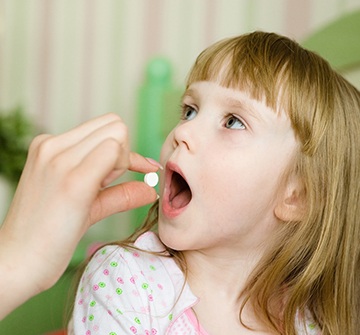 a child being given an oral sedative 