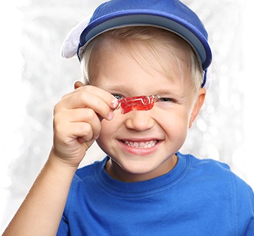 Child holding up phase one pediatric orthodontics device