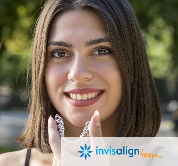 Young woman placing Invisalign teen clear braces tray