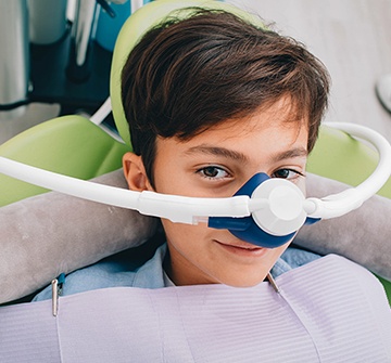 Child with nitrous oxide sedation dentistry mask