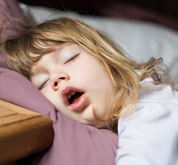 Child sleeping after oral conscious dental sedation visit