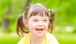 Laughing little girl outside