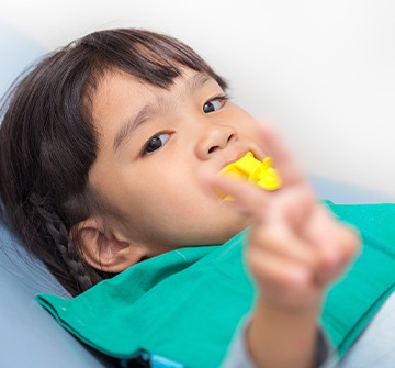 Young patient receiving fluoride treatment